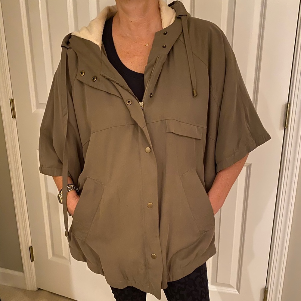 Olive fur lined poncho with hood.
